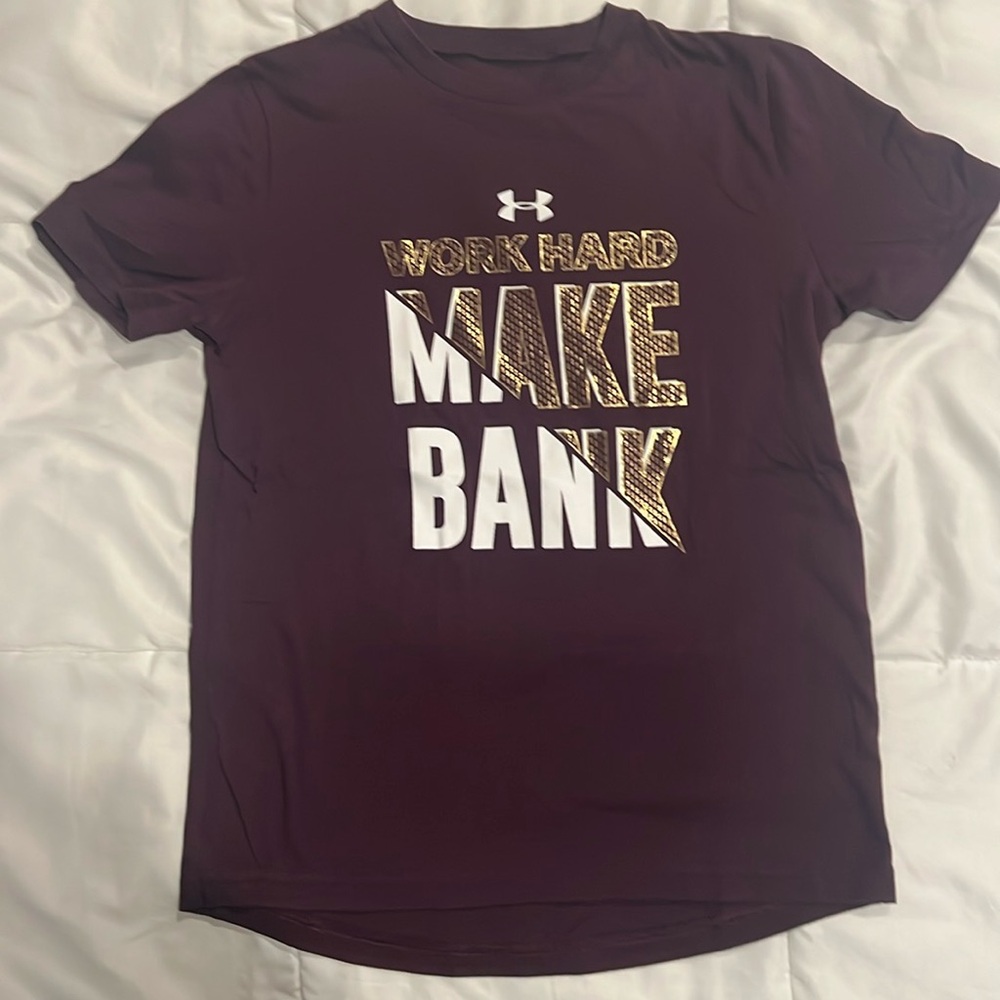 Under Armour- t-shirt, “work hard, make bank“ logo, gold/white graphic on front